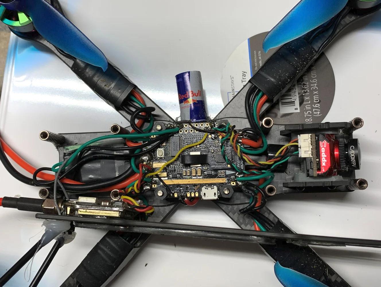 Internal electronics stack showing flight controller, ESC, and VTX wiring